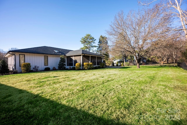 view of yard featuring a sunroom