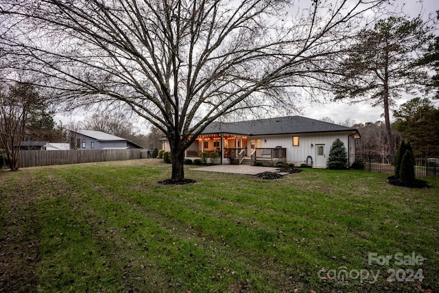 view of yard with a patio and a deck