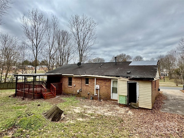 back of house featuring a deck