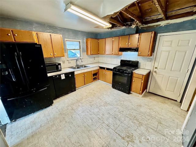 kitchen with sink and black appliances