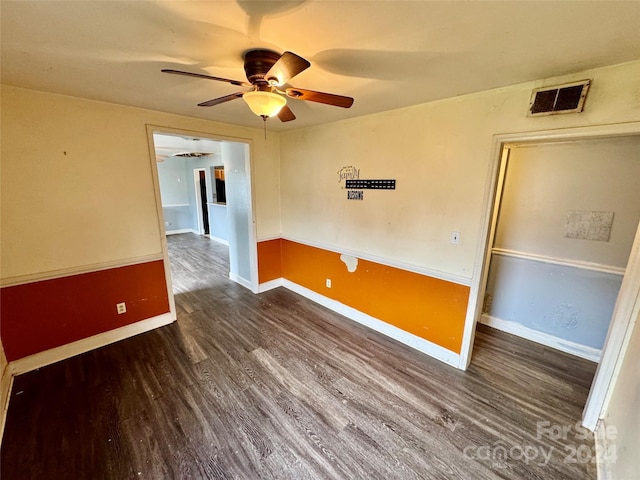 unfurnished room with dark hardwood / wood-style floors and ceiling fan