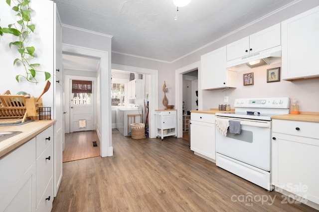 kitchen with white range with electric stovetop, washer / clothes dryer, light wood-type flooring, white cabinets, and ornamental molding