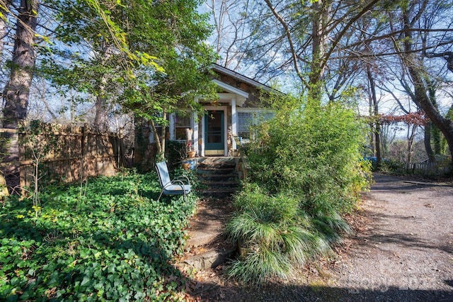 view of property hidden behind natural elements