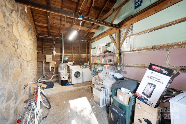 storage room featuring washing machine and dryer and water heater