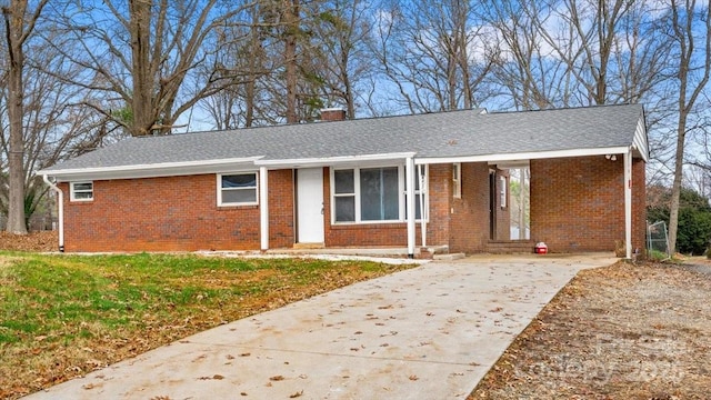 ranch-style house with a front lawn