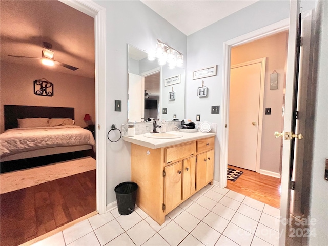 bathroom featuring tile patterned flooring, ceiling fan, and vanity