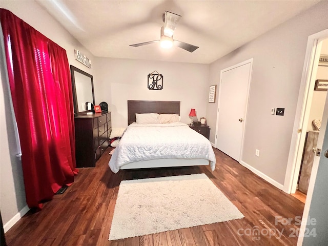 bedroom featuring ceiling fan and dark hardwood / wood-style floors