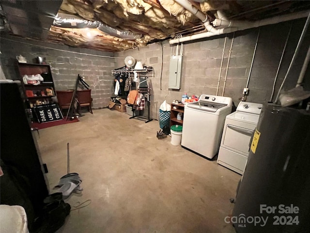 basement featuring independent washer and dryer and electric panel