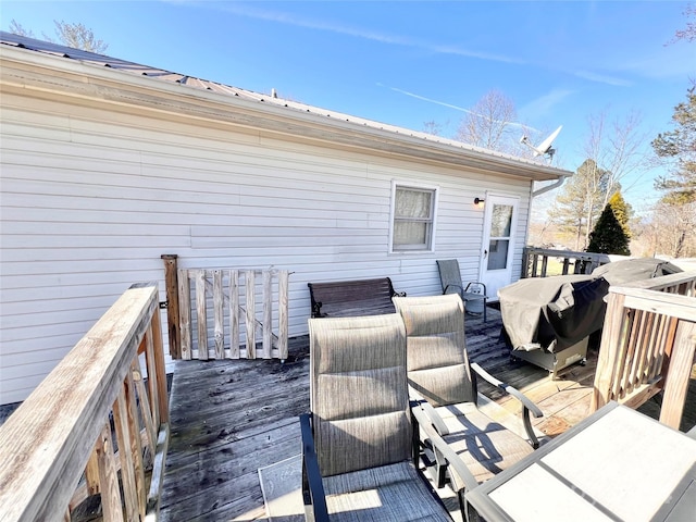 wooden terrace with grilling area