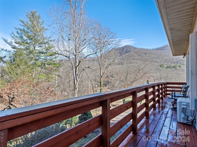 wooden terrace with a mountain view