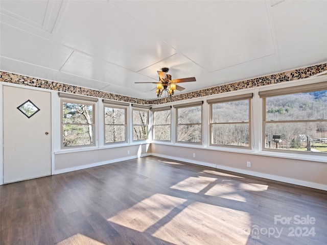 unfurnished sunroom featuring plenty of natural light and ceiling fan