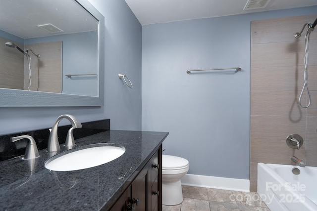 full bathroom featuring vanity, toilet, and tiled shower / bath combo