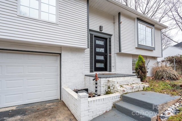 property entrance with a garage