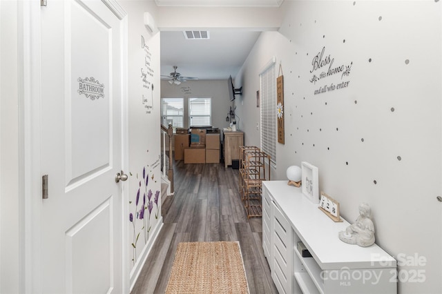 hallway with dark hardwood / wood-style flooring