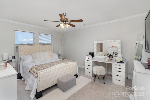 carpeted bedroom with ceiling fan and crown molding