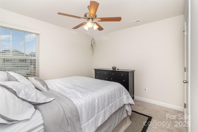 carpeted bedroom featuring ceiling fan