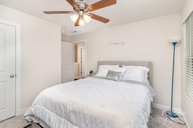 bedroom with ceiling fan and carpet floors