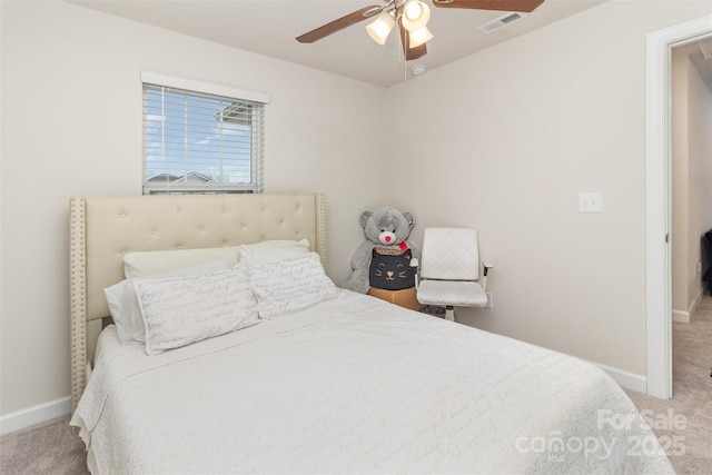 bedroom with ceiling fan and light carpet