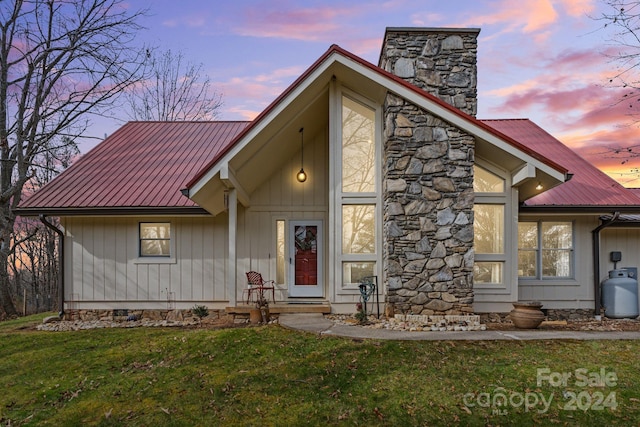 view of front of house with a lawn