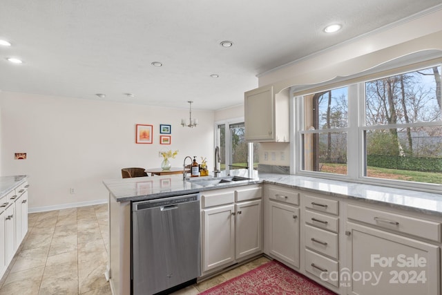 kitchen featuring kitchen peninsula, stainless steel dishwasher, sink, pendant lighting, and a notable chandelier