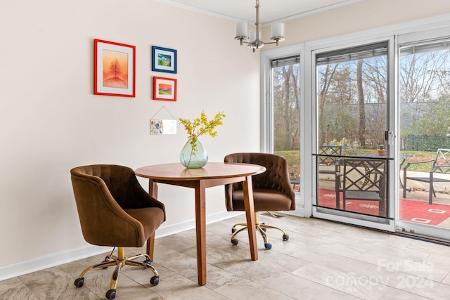 dining room with ornamental molding and a notable chandelier