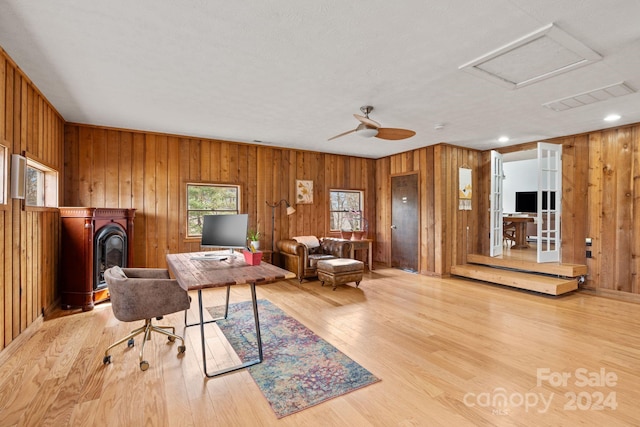 office featuring light hardwood / wood-style floors and ceiling fan