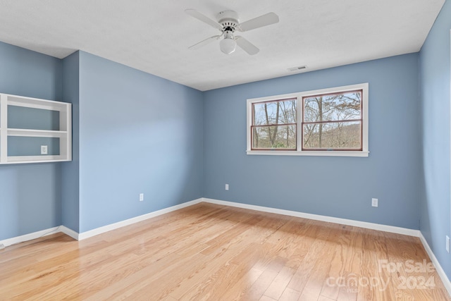 unfurnished room featuring light hardwood / wood-style floors and ceiling fan