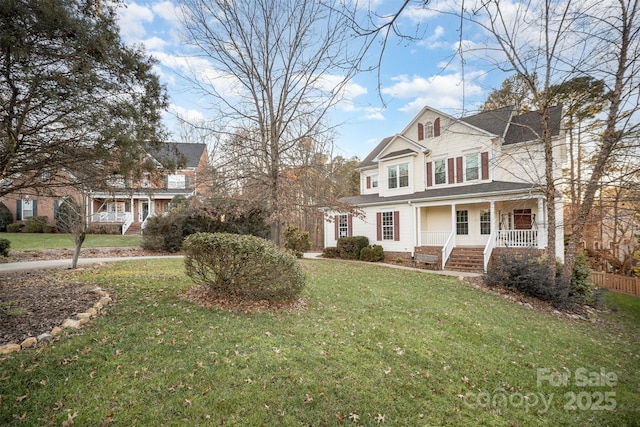 view of front of home with covered porch and a front yard