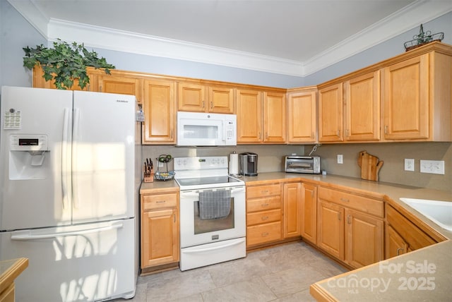 kitchen with white appliances, light tile patterned flooring, ornamental molding, and sink