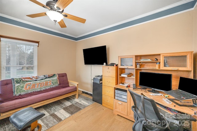 office featuring ceiling fan, ornamental molding, and hardwood / wood-style flooring