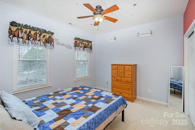 carpeted bedroom with ceiling fan