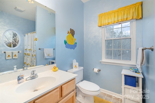 bathroom with toilet, a shower with shower curtain, vanity, and tile patterned floors