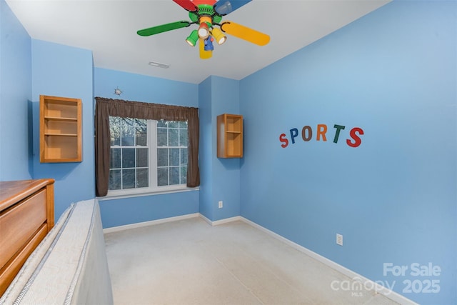 unfurnished bedroom featuring ceiling fan and light carpet