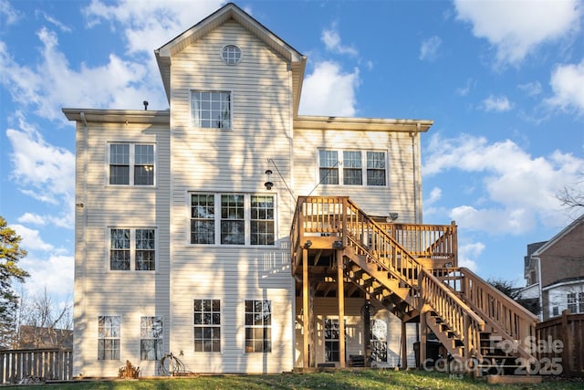 back of property with a wooden deck