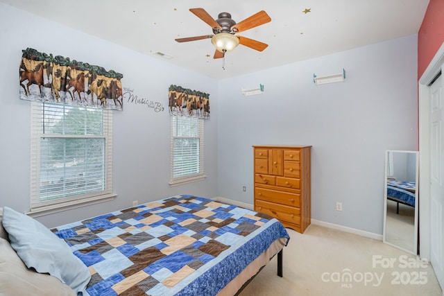 bedroom with baseboards, a ceiling fan, and light colored carpet