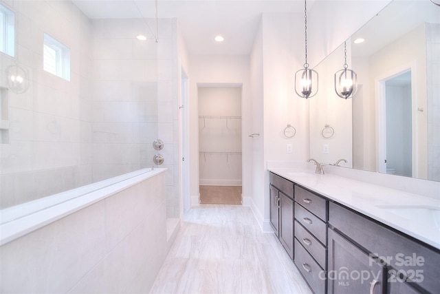 full bathroom featuring double vanity, toilet, a sink, and recessed lighting