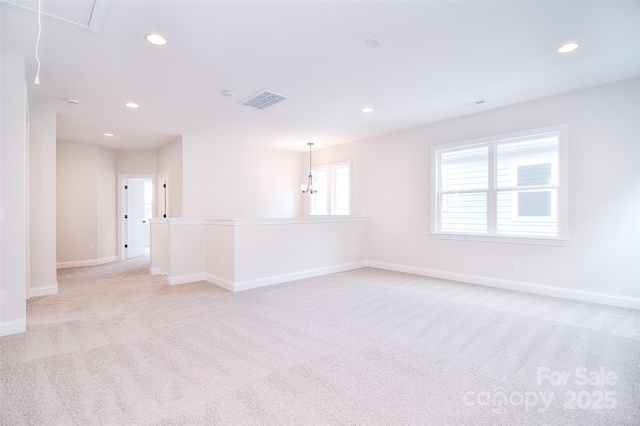 spare room with visible vents, attic access, and recessed lighting