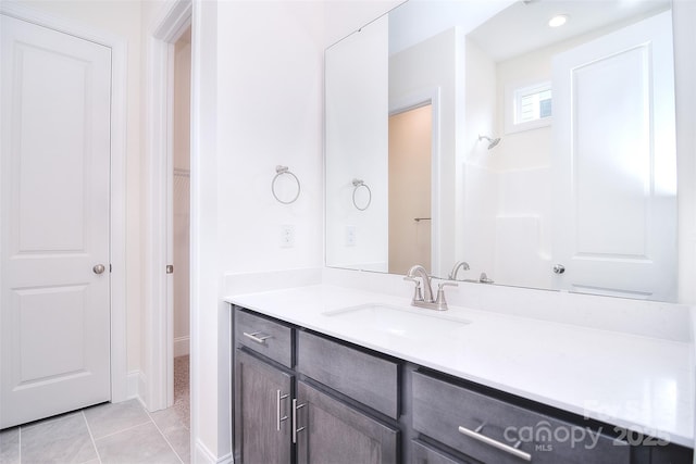 bathroom with tile patterned flooring and vanity