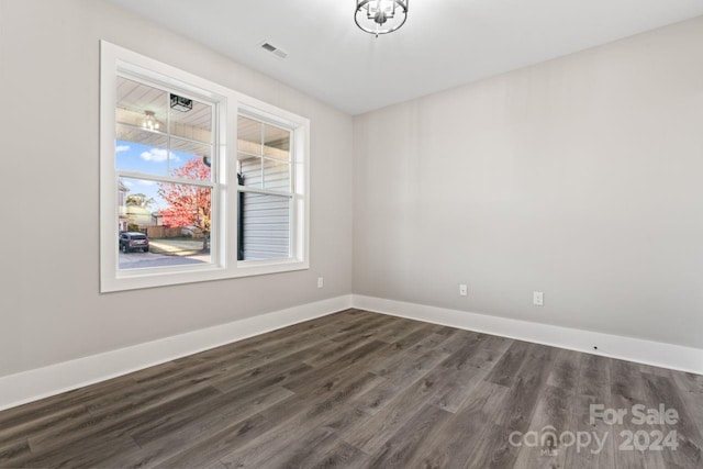 spare room featuring dark hardwood / wood-style flooring