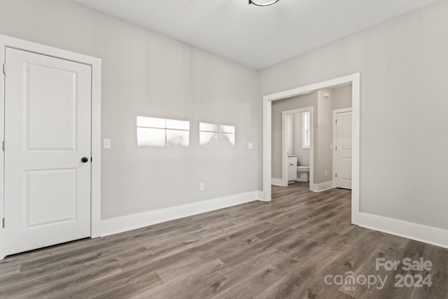 spare room with dark hardwood / wood-style floors