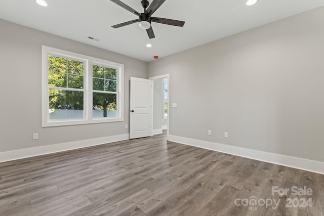 spare room with light hardwood / wood-style floors and ceiling fan