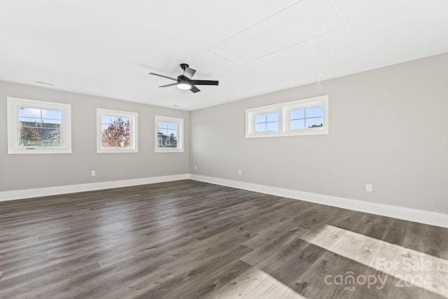 spare room with ceiling fan and dark wood-type flooring