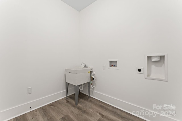 washroom featuring hardwood / wood-style floors, electric dryer hookup, and hookup for a washing machine