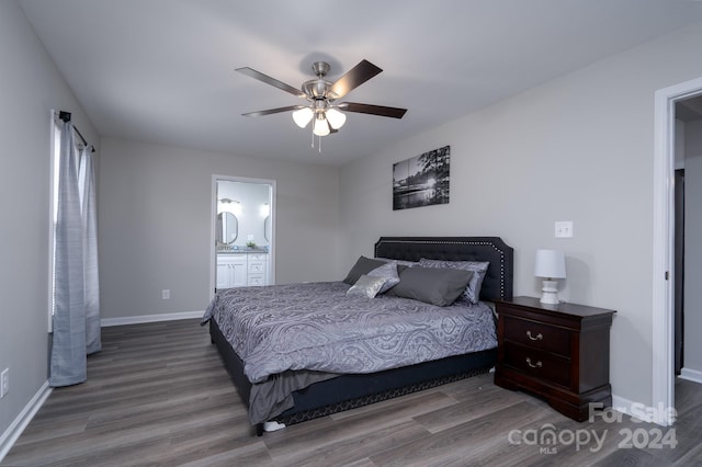 bedroom with wood-type flooring, ensuite bathroom, and ceiling fan