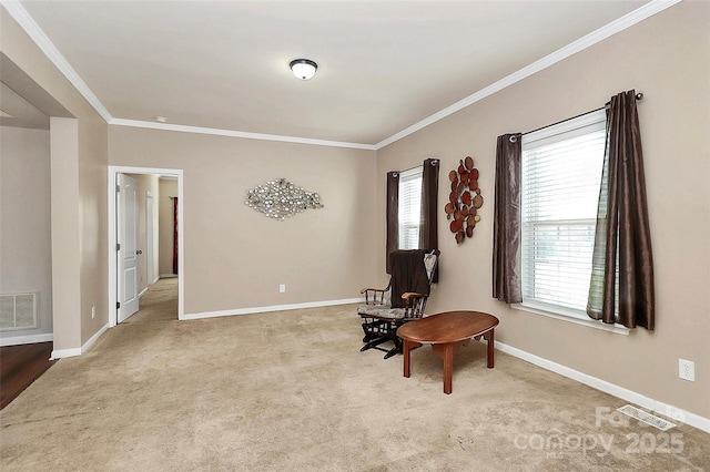 sitting room with light colored carpet and crown molding