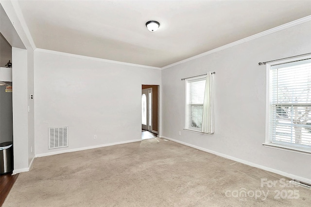 carpeted empty room with crown molding