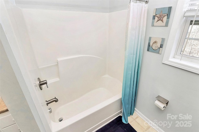 bathroom with shower / bath combo