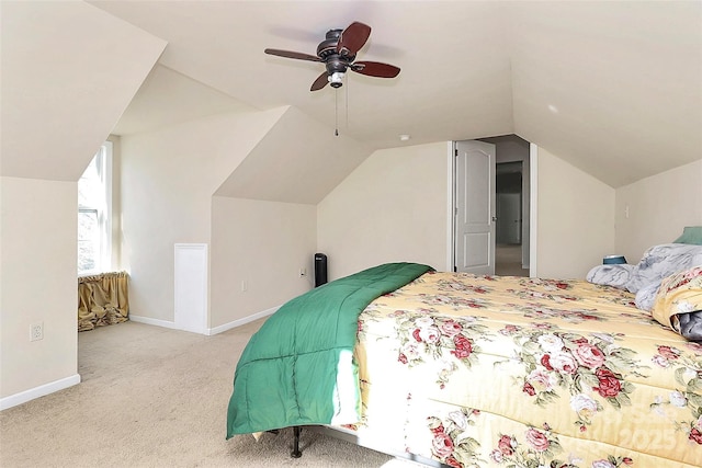 carpeted bedroom featuring lofted ceiling and ceiling fan