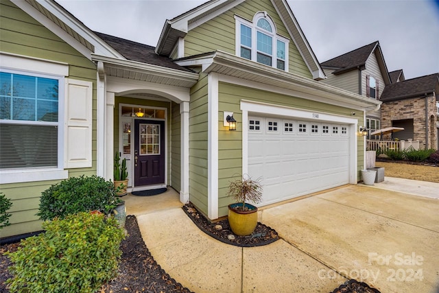 property entrance with a garage