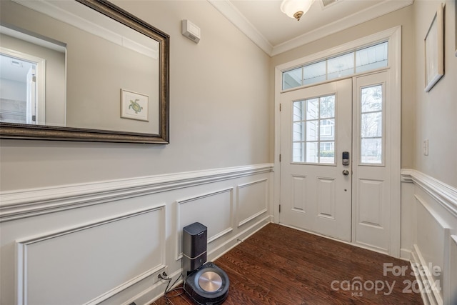 doorway to outside featuring crown molding and dark hardwood / wood-style flooring